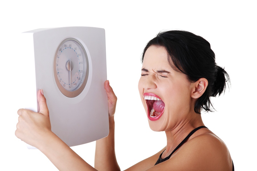 bigstock-Frustrated-woman-with-scale-i-39025033.jpg